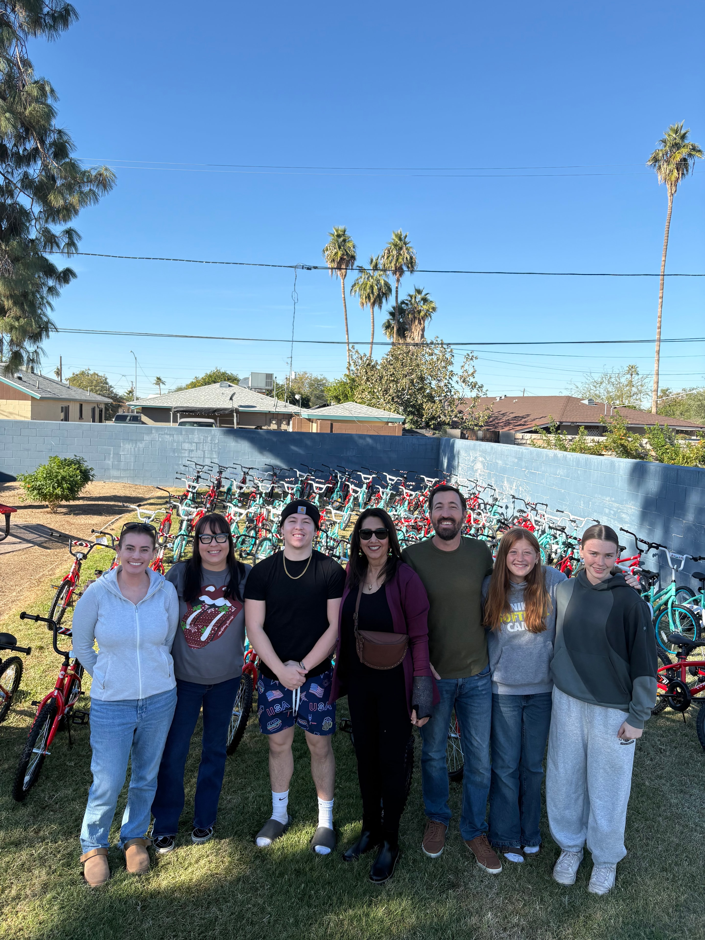 Arizona In Action team volunteers with donated bikes at a community event